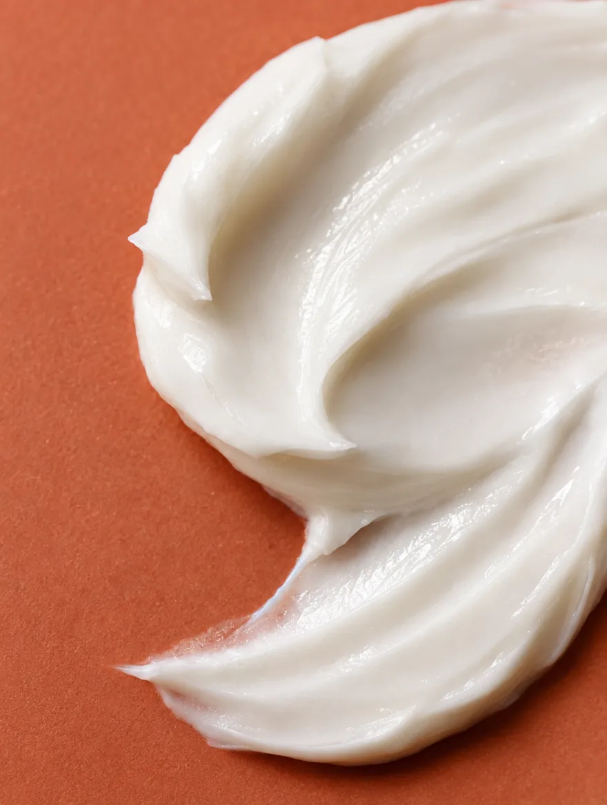 Macro of a cream texture swirl on terracotta